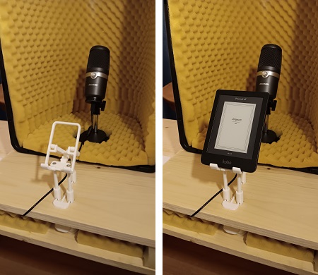 [A 3D printed stand allows the eBook with the recording scripts to be raised up or down.]